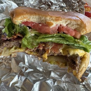 Percy's - Burger with the works, split in half so you can see all the goodness - Breakfast & Brunch Near Me - El Dorado, Arkansas Percy's - Burger with the works, split in half so you can see all the goodness - Breakfast & Brunch Near Me - El Dorado, Arkansas