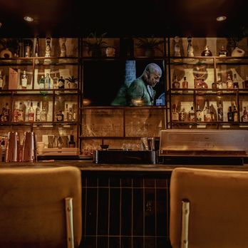 West Jax - a man sitting at a bar - Tobacco Shops Near Me - Fort Worth, Texas West Jax - a man sitting at a bar - Tobacco Shops Near Me - Fort Worth, Texas