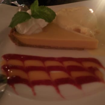 Dakshin - Mangocheesecake with a scoop of mango ice cream and dessert sauce - Indian Near Me - Washington, DC, District of Columbia
