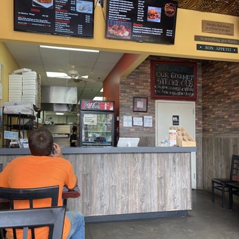 Luca's Pizzeria - a man sitting at the counter - Pizza Near Me - Murfreesboro, Tennessee