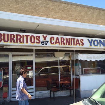 Carnitas & Burritos Yoni - a woman walking in front of a store - Mexican Near Me - El Paso, Texas
