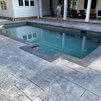 Michael Enterprises Pools and Spas - Rectangle with tanning ledge and swim out outside the pool.  Travertine pavers on deck. - Pool & Hot Tub Service Near Me - Statham, Georgia