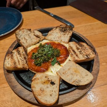 Traveler's Table - Argentinian Provoleta - Cocktail Bars Near Me - Houston, Texas