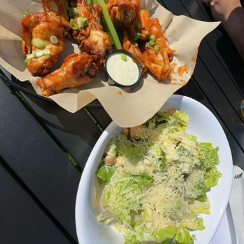 The Brass Tap - Zing and Buffalo chicken wings with a Caesar salad. Both good - Sports Bars Near Me - Marina, California The Brass Tap - Zing and Buffalo chicken wings with a Caesar salad. Both good - Sports Bars Near Me - Marina, California