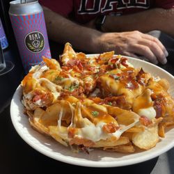 One Main Restaurant & Lounge - Poutine!!!! What in the cheesy gravy. You should be here eating it!