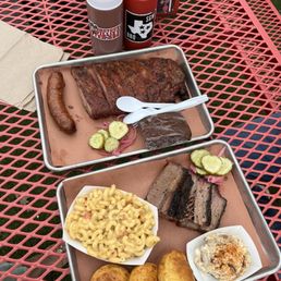 Ribs, brisket, jalepeno cheese sausage, mac and cheese, dill pickle potato salad, corn bread, Texas chocolate cake dessert