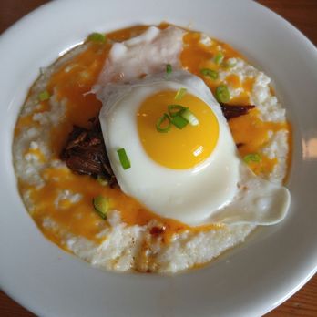 Mockingbird Cafe - Pulled Pork Cheese Grits with Sunny Side Up Egg! - Cafes Near Me - Bay Saint Louis, Mississippi Mockingbird Cafe - Pulled Pork Cheese Grits with Sunny Side Up Egg! - Cafes Near Me - Bay Saint Louis, Mississippi