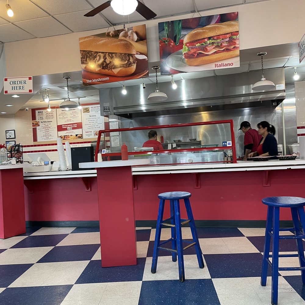 Philly Corner - Order placing and pickup with grille behind - Cheesesteaks Near Me - Charlotte, North Carolina Philly Corner - Order placing and pickup with grille behind - Cheesesteaks Near Me - Charlotte, North Carolina