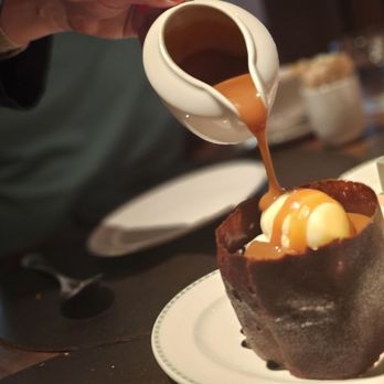 BAR Bludorn - Salted caramel pour atop warm chocolate cake. Great dessert - Wine Bars Near Me - Houston, Texas BAR Bludorn - Salted caramel pour atop warm chocolate cake. Great dessert - Wine Bars Near Me - Houston, Texas