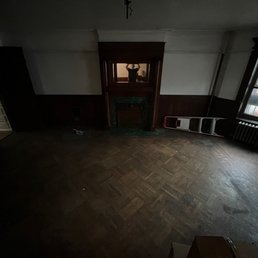 an empty room with wooden floors