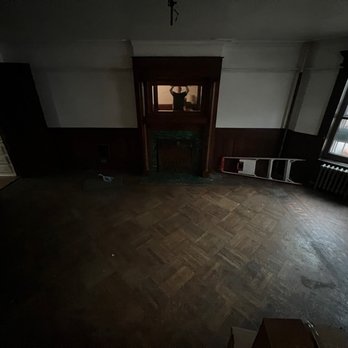 Floors By Jay - an empty room with wooden floors - Flooring Near Me