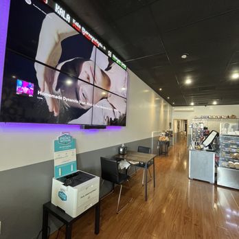 Bagel Exchange - Music video big screen with stock ticker in restaurant interior - Coffee & Tea Near Me - Alhambra, California Bagel Exchange - Music video big screen with stock ticker in restaurant interior - Coffee & Tea Near Me - Alhambra, California