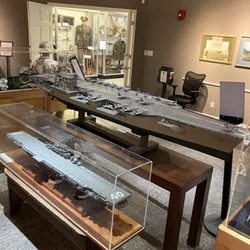 Naples Museum of Military History - Handmade carriers display with a WWII display behind it