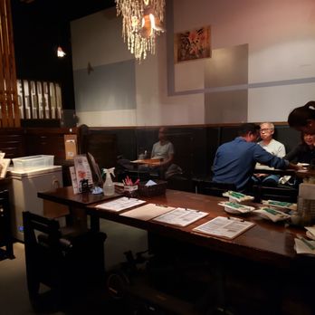 Zakkushi Dining On Main - two people sitting at a table - Japanese Near Me - Vancouver, British Columbia Zakkushi Dining On Main - two people sitting at a table - Japanese Near Me - Vancouver, British Columbia