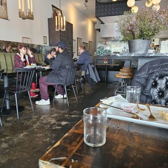 The New Deal - people sitting at tables in a restaurant - American Near Me - Burbank, California The New Deal - people sitting at tables in a restaurant - American Near Me - Burbank, California