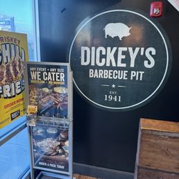 a sign for dickey's barbecue pit a sign for dickey's barbecue pit