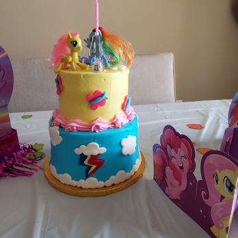 Cakeology - a table with a cake and decorations - Custom Cakes Near Me - Montgomery, Alabama