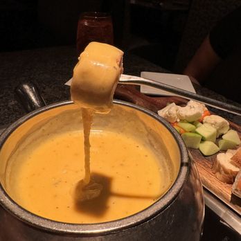 The Melting Pot - Cheese pull - Fondue Near Me - Orlando, Florida The Melting Pot - Cheese pull - Fondue Near Me - Orlando, Florida