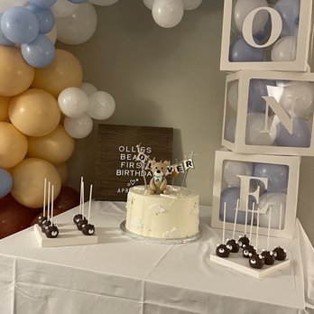 Marchessa's Cucina - Simple table setting with the cake and bear cake pops. - Custom Cakes Near Me