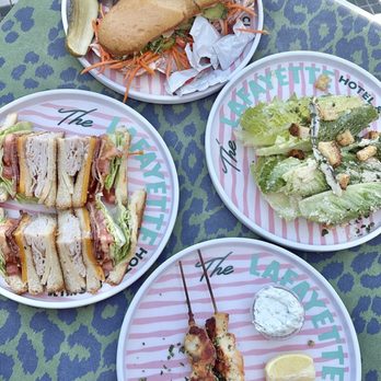 Pool Bar - Lafayette Hotel - Cali Banh Mi Sándwich Club Sándwich Side César Salad Lemon & herb marinated chicken skewers - Lounges Near Me - San Diego, California Pool Bar - Lafayette Hotel - Cali Banh Mi Sándwich Club Sándwich Side César Salad Lemon & herb marinated chicken skewers - Lounges Near Me - San Diego, California