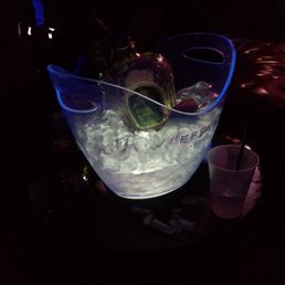 a large ice bucket filled with ice and garnish a large ice bucket filled with ice and garnish