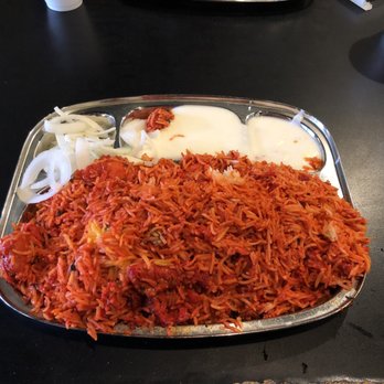 Ghareeb Nawaz Express - Chili chicken biryani with sides of yogurt sauce and onions - Indian Near Me - Chicago, Illinois Ghareeb Nawaz Express - Chili chicken biryani with sides of yogurt sauce and onions - Indian Near Me - Chicago, Illinois