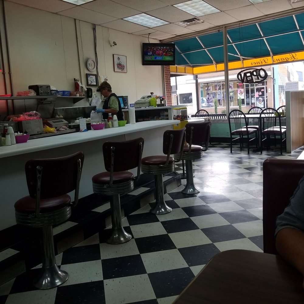 Small town diner with booths and counter seating. Small town diner with booths and counter seating.