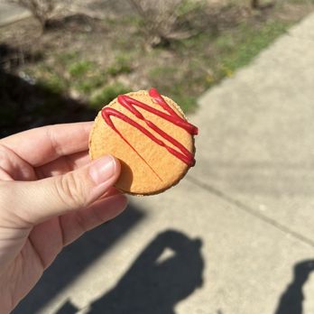 The Cheesecakery - a person holding a cookie - Food Trucks Near Me - Cincinnati, Ohio