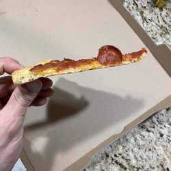 Little Caesars - the compressed dough was rock hard