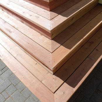 John E Hughes Construction - a close up of a wooden staircase - General Contractors Near Me