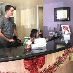 Koll Center Dental Group - Dr. Ewing and Lai at the front desk