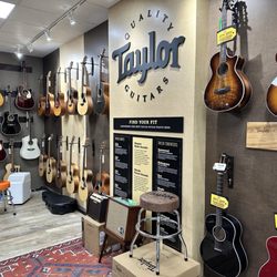 Tone Shop Guitars - The Taylor room with all the acoustics