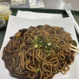 a plate of noodles and chopsticks a plate of noodles and chopsticks