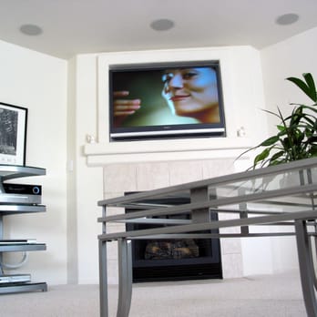 Ray Moss Electric - Custom installation above fireplace, with in ceiling speakers - Solar Installation Near Me