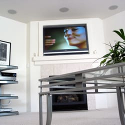 Ray Moss Electric - Custom installation above fireplace, with in ceiling speakers