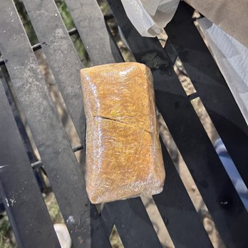 Tassili's Raw Reality - a piece of bread on a bench - Vegan Near Me - Atlanta, Georgia Tassili's Raw Reality - a piece of bread on a bench - Vegan Near Me - Atlanta, Georgia
