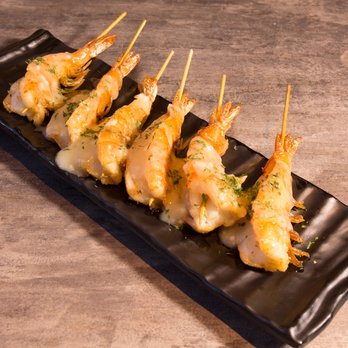 Taiyo - a plate of shrimp skewers on a black plate - Sushi Bars Near Me - Longueuil, Quebec Taiyo - a plate of shrimp skewers on a black plate - Sushi Bars Near Me - Longueuil, Quebec