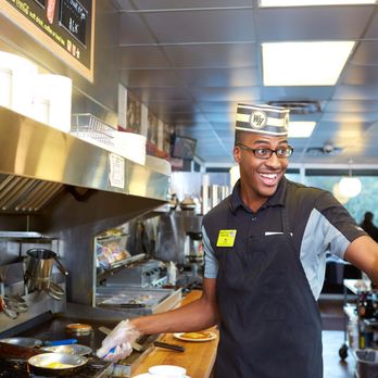 Waffle House - a man in a kitchen preparing food - Diners Near Me - Cedartown, Georgia