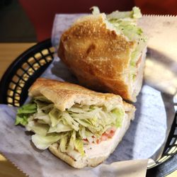Sicilia Pizza and Restaurant - My buddy was so hungry he took a bite before I could take the picture. His turkey and cheese sub