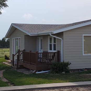Elite Renovations - the front of a home with a porch - Flooring Near Me - Mitchell, South Dakota Elite Renovations - the front of a home with a porch - Flooring Near Me - Mitchell, South Dakota
