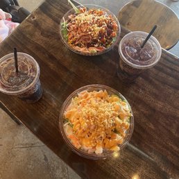Hula Bowl and a custom bowl with brown rice, salad, spicy chicken and toppings. Hula Bowl and a custom bowl with brown rice, salad, spicy chicken and toppings.