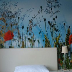 Haus Gellermann - Zimmer mit Wandtapete.