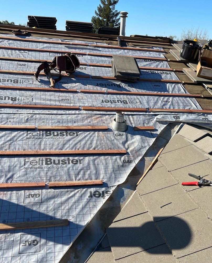 Slide of Fili's Roofing