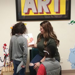 Child Care Links - Janel(staff) allowing the kids take turns reading