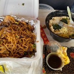 a container of noodles and chopsticks