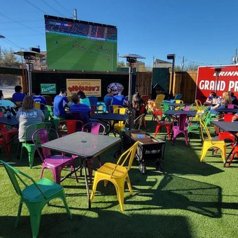 Little Woodrow's EaDo - a large group of people sitting at tables and chairs - Sports Bars Near Me - Houston, Texas
