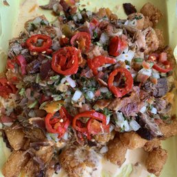 Pulled Pork Stack (tots, pulled Pork, queso, pico de Gallo, jalapeños & peppers, cilantro). HUGE portion. Delicious. Pulled Pork Stack (tots, pulled Pork, queso, pico de Gallo, jalapeños & peppers, cilantro). HUGE portion. Delicious.