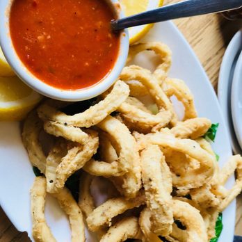 Restaurant Los Langostinos - a plate of deep fried squids and a side of tomato sauce - Mexican Near Me - Chicago, Illinois