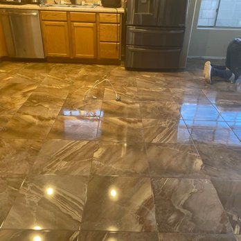 Floor One - a kitchen with marble flooring and stainless steel appliances - Flooring Near Me