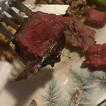 Aroma Tavern and Buffalo Bar - a piece of steak on a plate with asparagus - Seafood Near Me - Fish Camp, California Aroma Tavern and Buffalo Bar - a piece of steak on a plate with asparagus - Seafood Near Me - Fish Camp, California